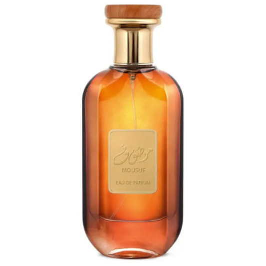 A glass bottle of Mousuf Perfume by Ard Al Zaafaran with a wooden cap and a label in front, displaying the name and fragrance type. Clone / dupe of / inspired by Paco Rabanne - 1 Million Lucky perfume. Amber Gradient Mousuf Perfume Bottle – Elegant amber gradient glass bottle of Mousuf Eau de Parfum with a gold and wood-accented cap, exuding luxury and oriental fragrance allure.
