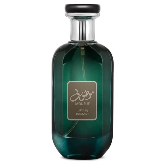 Mousuf Ramadi Eau de Parfum bottle – luxury Arabian fragrance in an elegant emerald green glass bottle with silver cap, offering a sophisticated woody and musky scent for men and women. A green glass perfume bottle with a black cap and a label displaying 'Mousuf Ramadi' by Ard Al Zaafaran. Clone / dupe of / inspired by Jean Paul Gaultier - Ultra Male perfume.