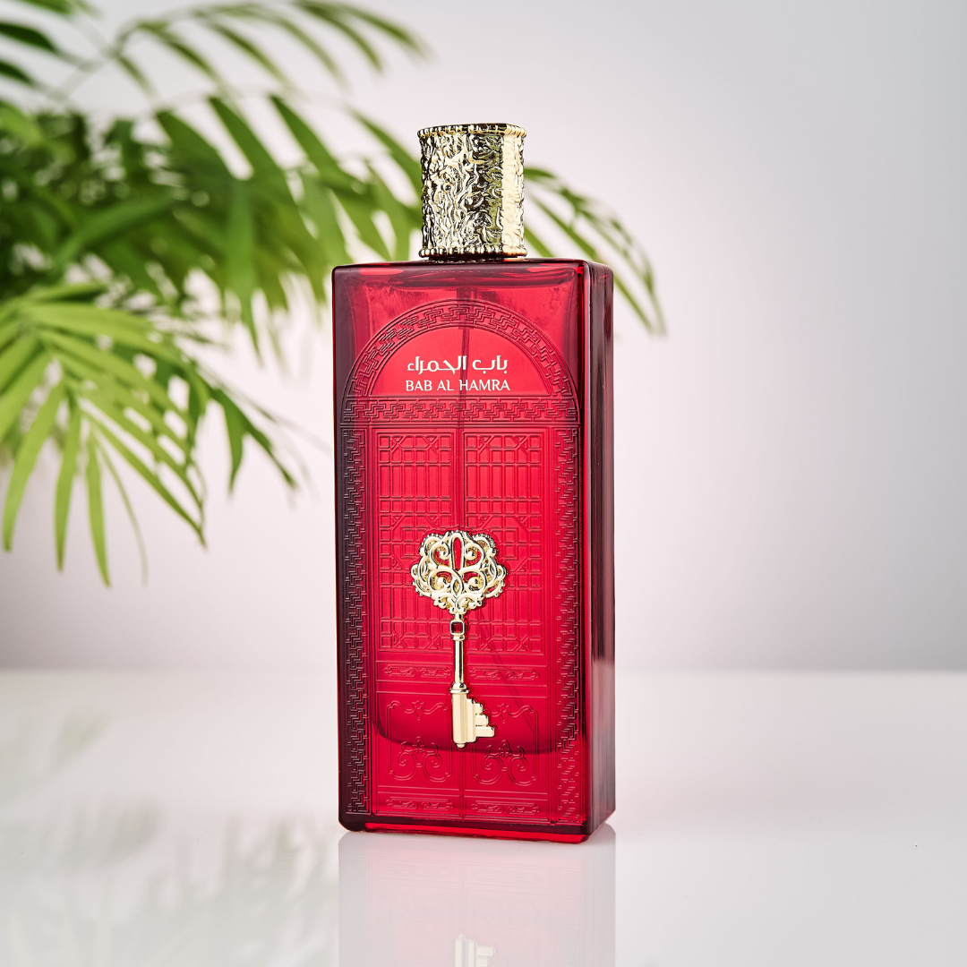Red perfume bottle with gold accents on a white background. Bab Al Hamra by Ard Al Zaafaran Mens Perfume