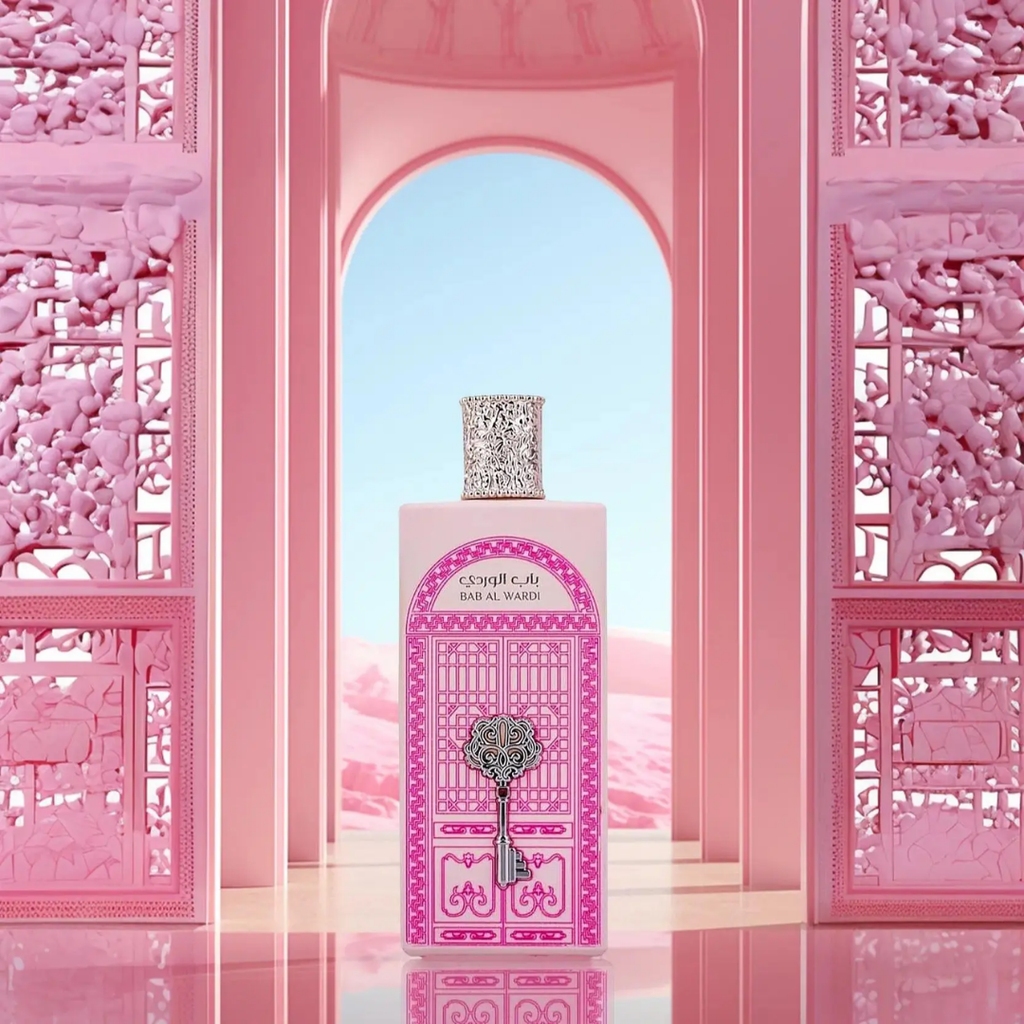Pink perfume bottle with decorative design in front of a pink archway. Bab Al Wardi by Ard Al Zaafaran Womens Perfume
