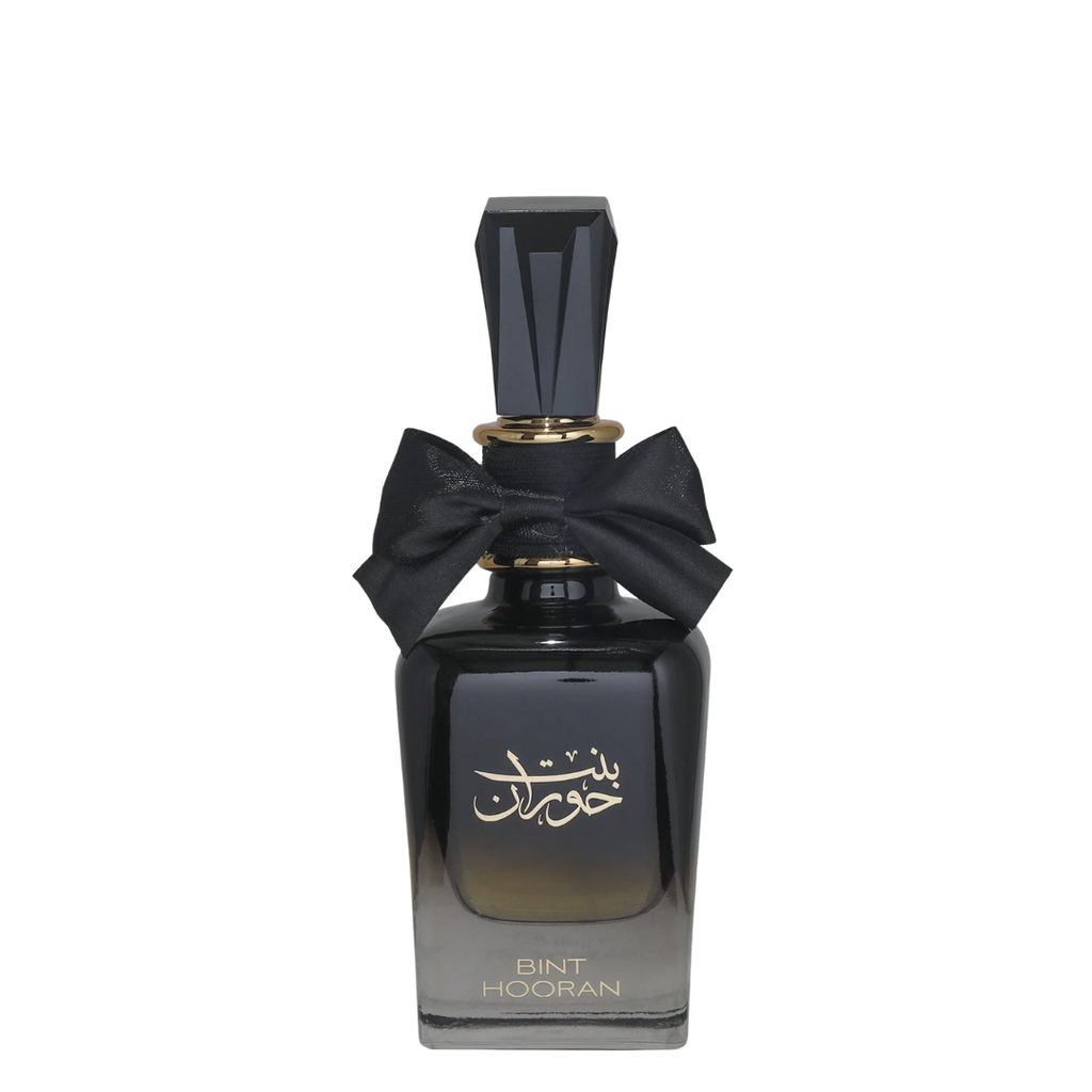 A curved, black perfume bottle with a label in Arabic script, topped with a black bow. Bint Hooran Womens Perfume by Ard Al Zaafaran