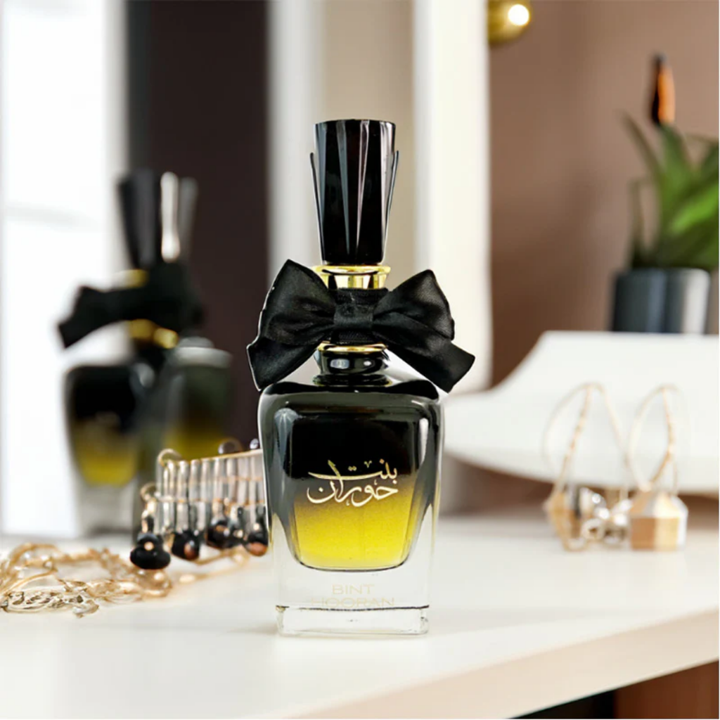 Perfume bottle with black bow on white surface. Bint Hooran Womens Perfume by Ard Al Zaafaran