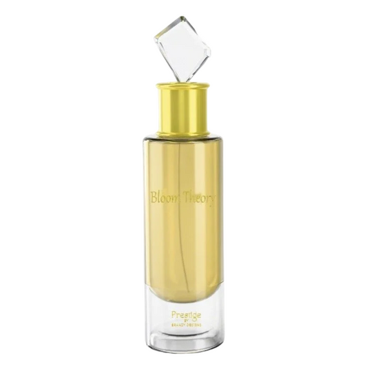 Gold perfume bottle with clear cap on a white background. Bloom Theory by Brandy Designs Unisex Perfume.