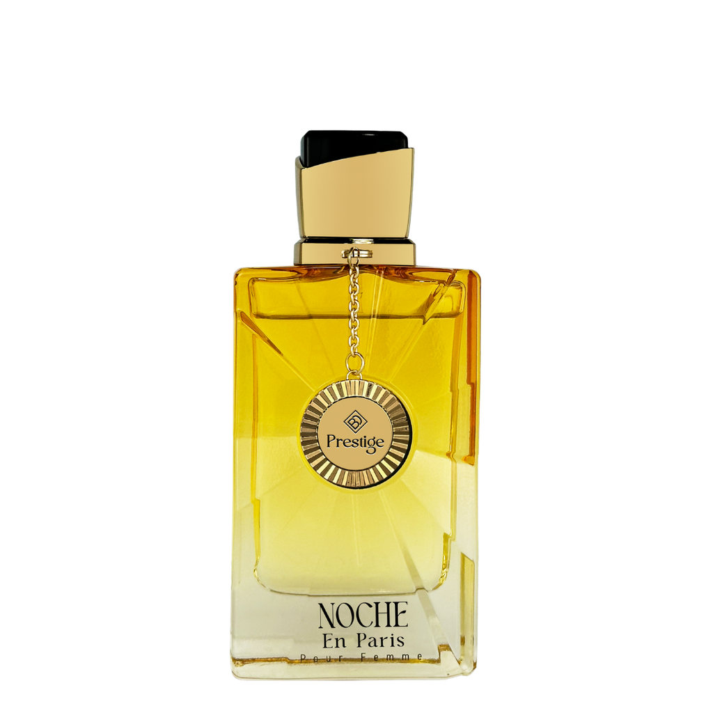 Perfume bottle labeled 'Noche En Paris' with gold cap on a white background. Brandy Designs Prestige: Noche En Paris Pour Femme