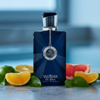 Blue perfume bottle labeled 'Valerian De Bleu' with citrus fruits on a blurred background