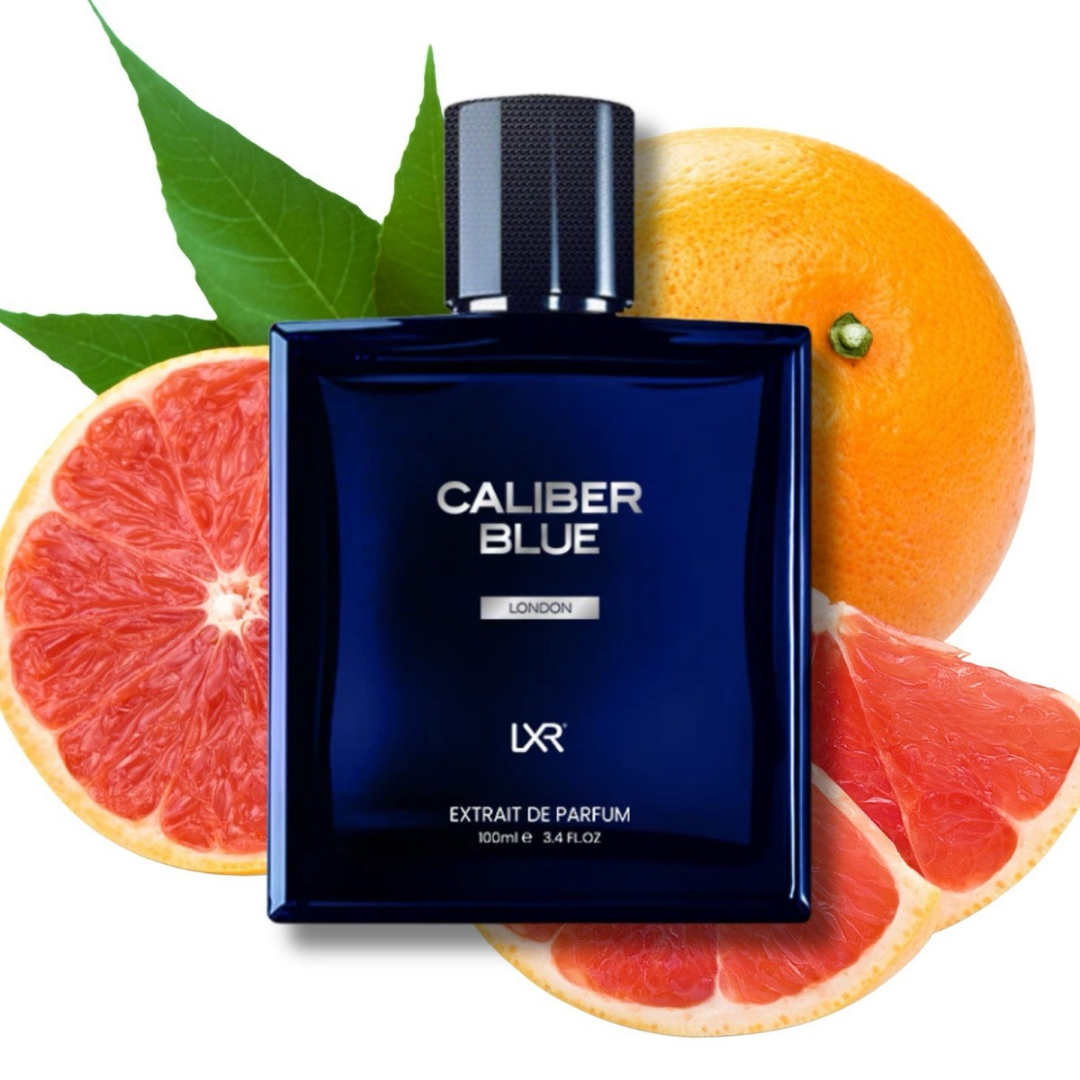 Blue perfume bottle labeled 'Caliber Blue' surrounded by sliced oranges and leaves on a white background. Caliber Blue by LXR Mens Perfume