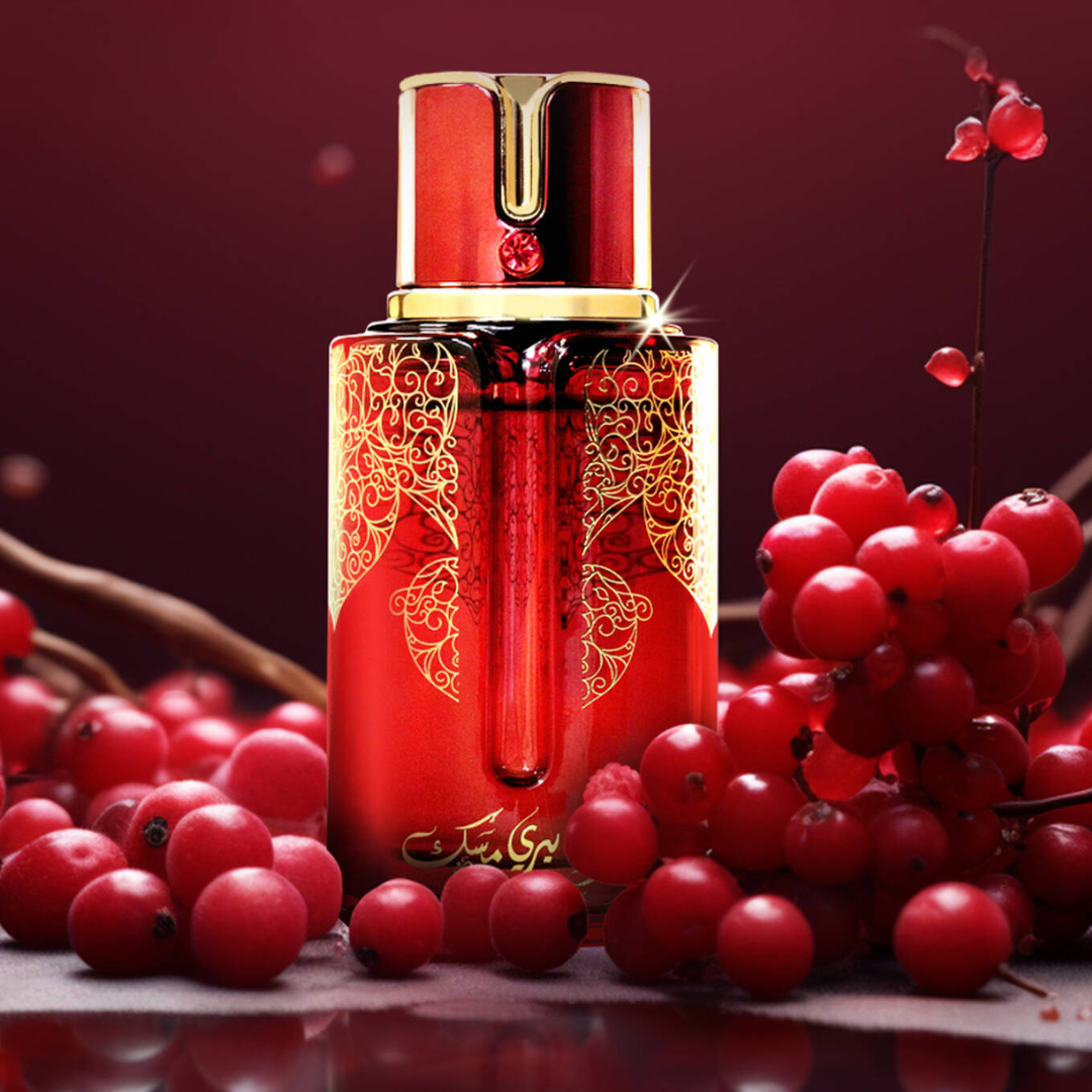 Red and gold cosmetic bottle with berries on a red background. Cranberry Musk by Arabiyat Prestige Unisex Perfume