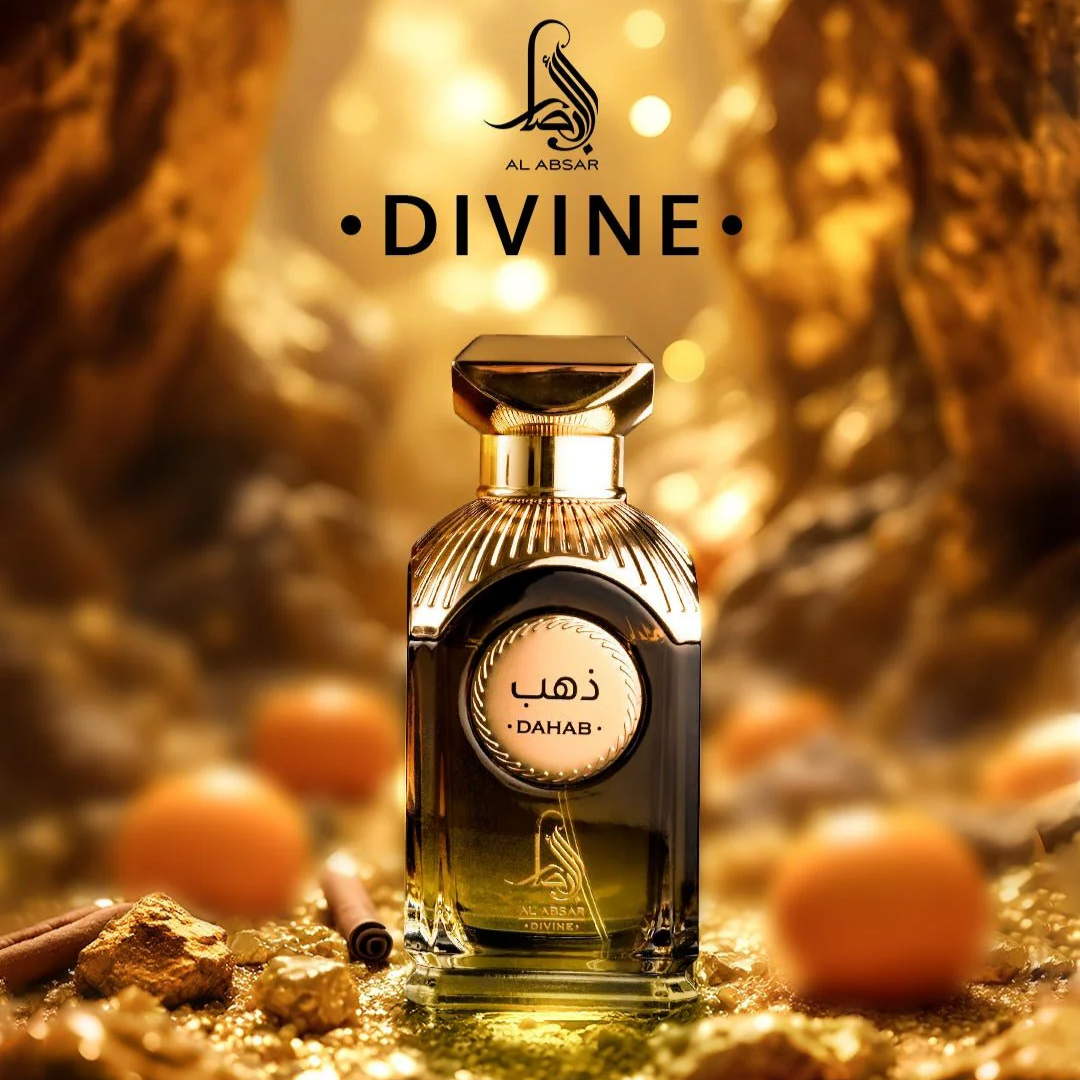 Perfume bottle labeled 'Divine' by Al Absar with oranges and gold elements in the background. Dahab by Al Absar Womens Perfume