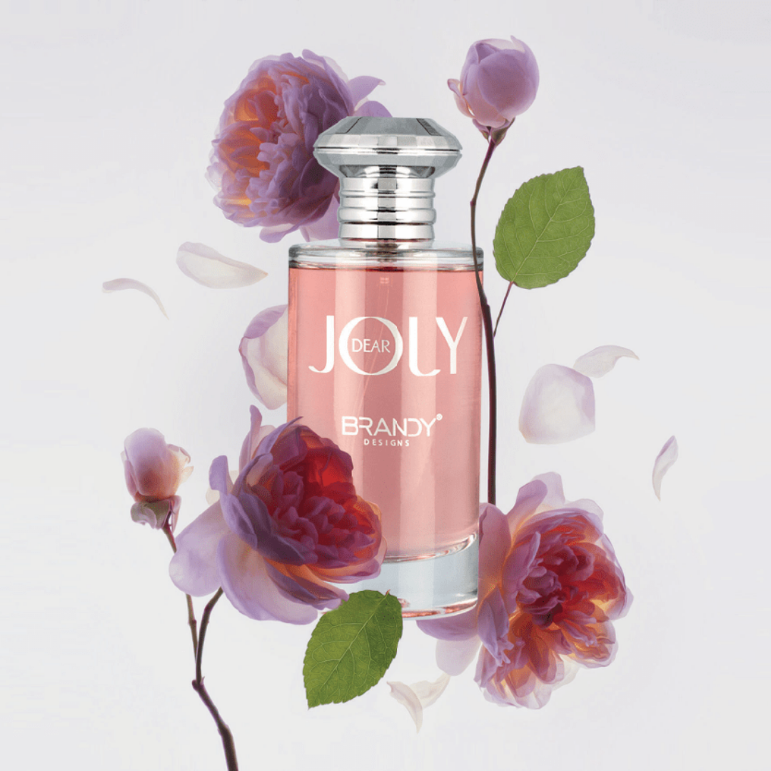 Perfume bottle labeled 'Dear Joly Brandy' surrounded by flowers on a light background. Dear Joly by Brandy Designs Womens Perfume