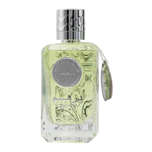 A clear glass bottle of Dirham Silver Perfume with a silver cap and label, containing the yellowish perfume liquid. Dirham Silver Unisex Perfume by Ard Al Zaafaran