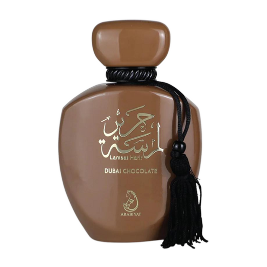 Brown perfume bottle with Arabic text and tassel on a white background. Dubai Chocolate by Arabiyat Unisex Perfume