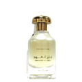 A clear glass bottle of Fakhar Al Oud The White Oud Perfume with a gold-colored cap, labeled with the product name and brand.
