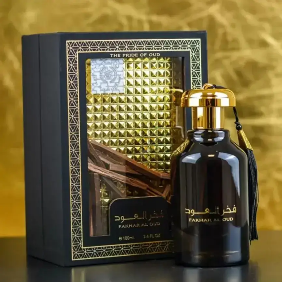 Fakhr Al Oud perfume bottle with packaging on a gold background