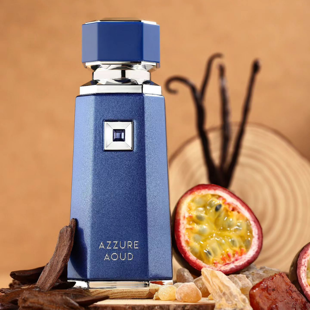 Blue perfume bottle labeled 'Azzure Aoud' with a background of spices and fruit.