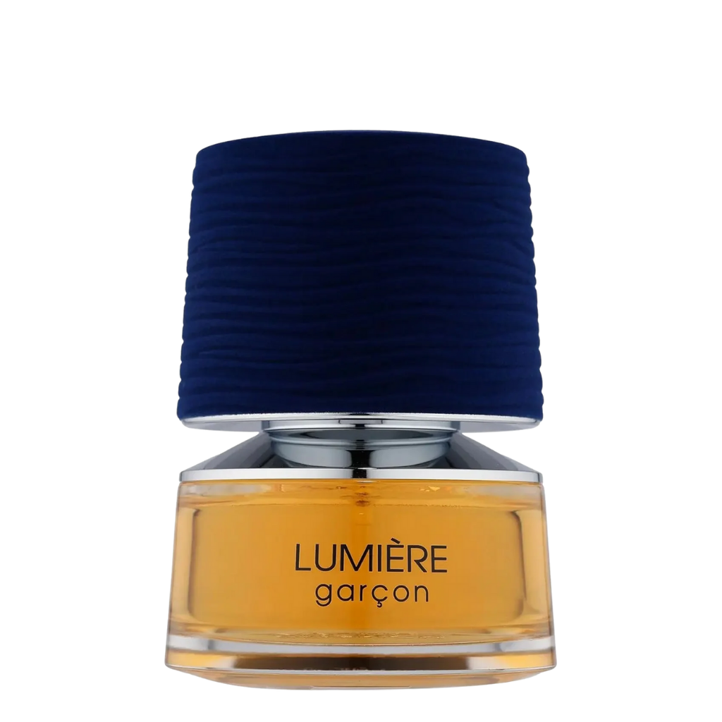 A bottle of Lumiere Garcon perfume with a blue cap and amber-colored liquid visible through the transparent bottle.
