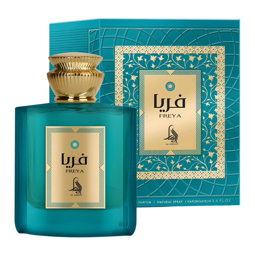 Teal Freya perfume bottle and packaging with gold accents on a white background