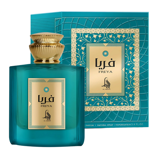 Teal Freya perfume bottle and packaging with gold accents on a white background