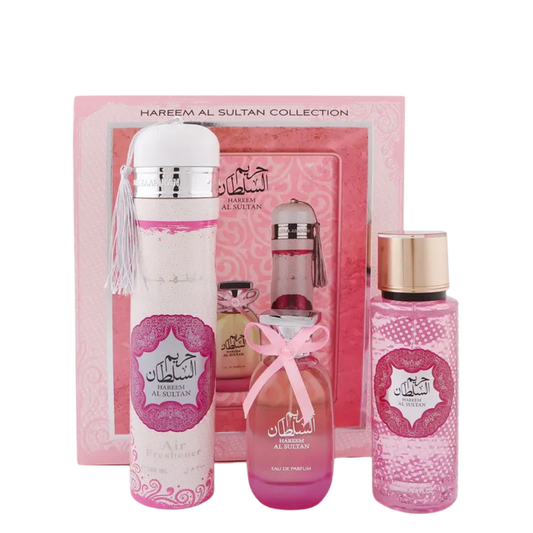 Hareem Al Sultan perfume set with pink and white bottles against a pink background