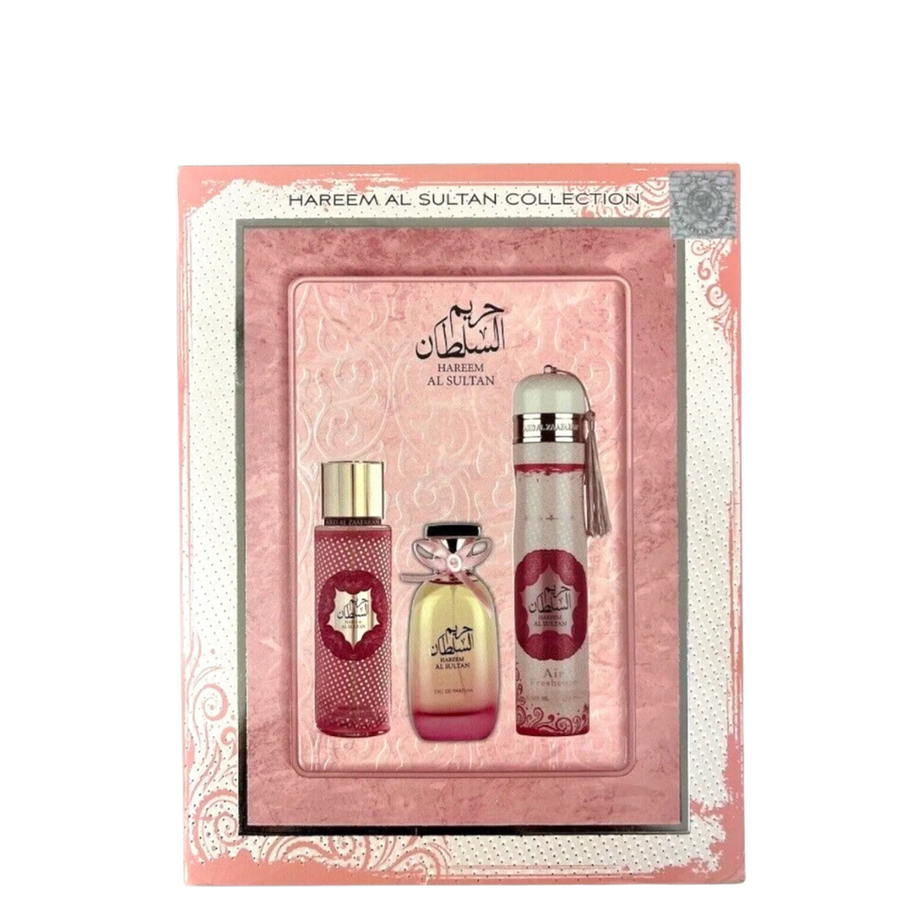 A 3-piece gift set by Ard Al Zaafaran, Hareem Al Sultan collection, containing a perfume mist, perfume EDP, and an air freshener, all presented in a pink and gold box.