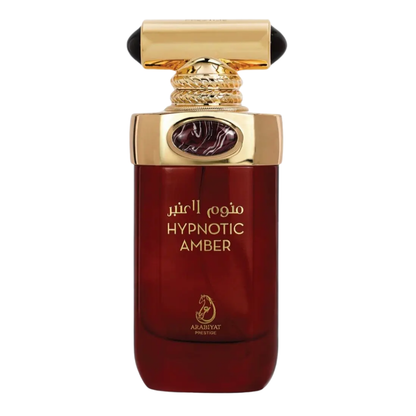 A Hypnotic Amber perfume bottle with a dark liquid visible and gold-colored cap.