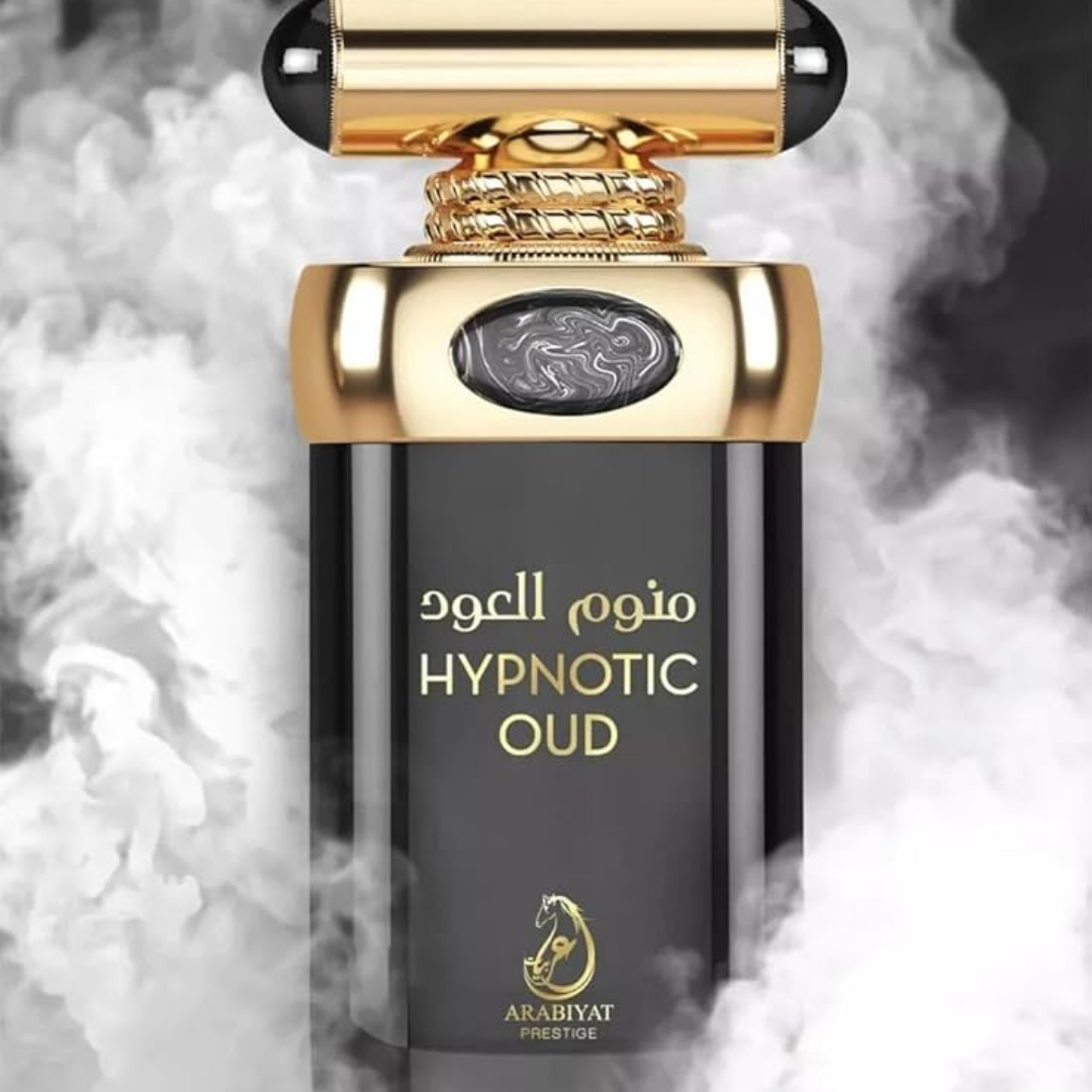 Perfume bottle labeled 'Hypnotic Oud' with gold accents on a smoky background. Hypnotic Oud by Arabiyat Prestige Unisex Perfume