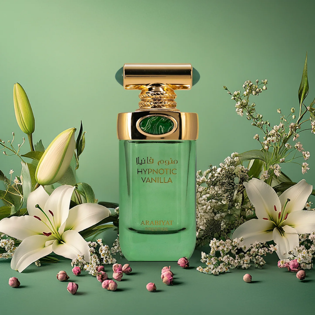 Perfume bottle labeled 'Hypnotic Vanilla' with flowers and petals on a green background. 