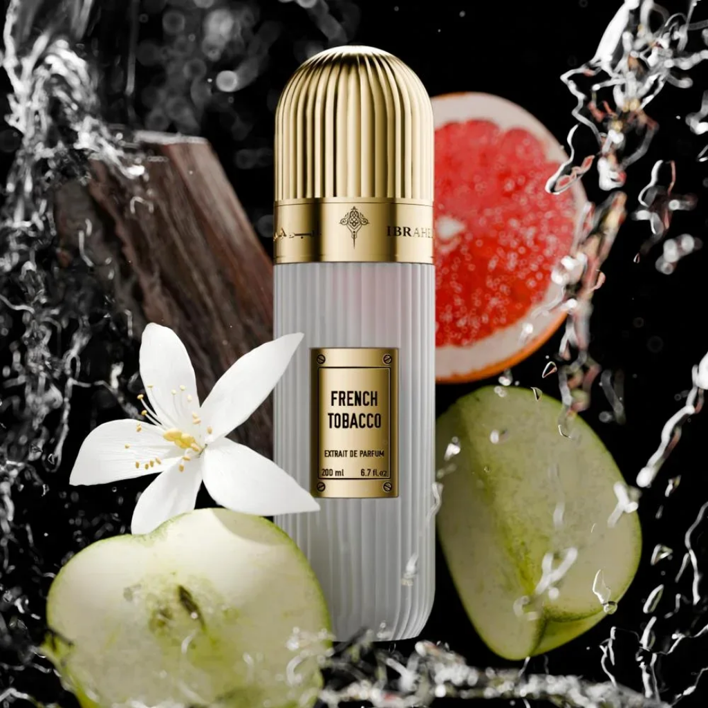 IBRAQ perfume bottle labelled 'French Tobacco' with sliced fruit and a flower on a dark background