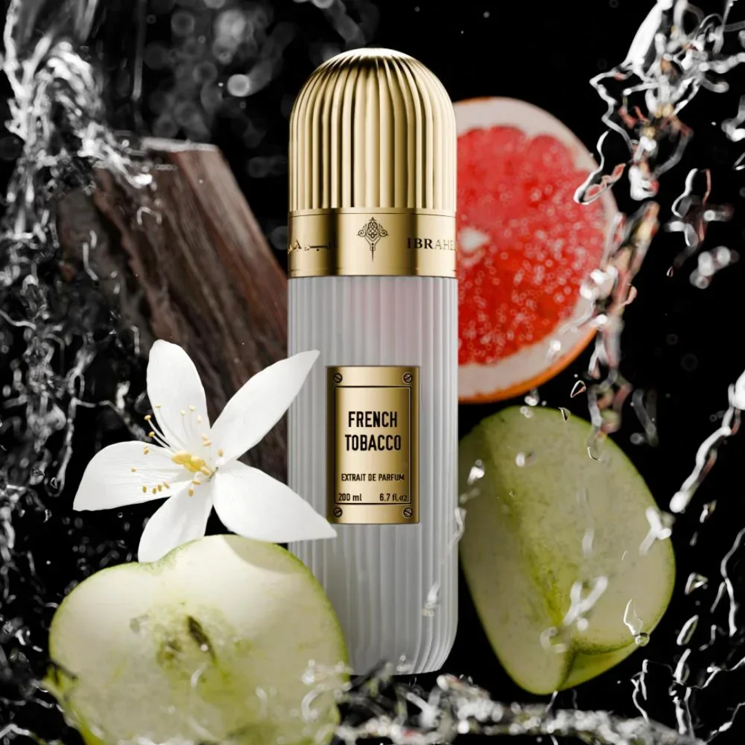 IBRAQ perfume bottle labelled 'French Tobacco' with sliced fruit and a flower on a dark background