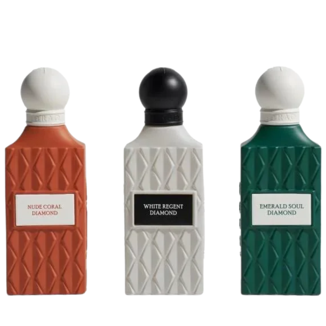 Three perfume bottles with textured geometric designs, labeled Nude Coral Diamond, White Regent Diamond, and Emerald Soul Diamond, shown against a plain white background. IBRAQ: Grey Wish Set