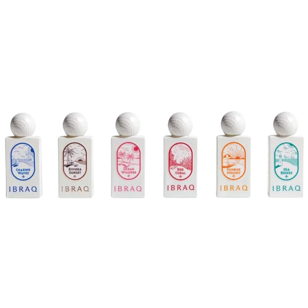 Six small rectangular bottles of IBRAQ fragrance oil arranged in a row on a plain white background. Each bottle has a white cap and a white body with a different colored label illustration and text. IBRAQ: Mini Summer Collection