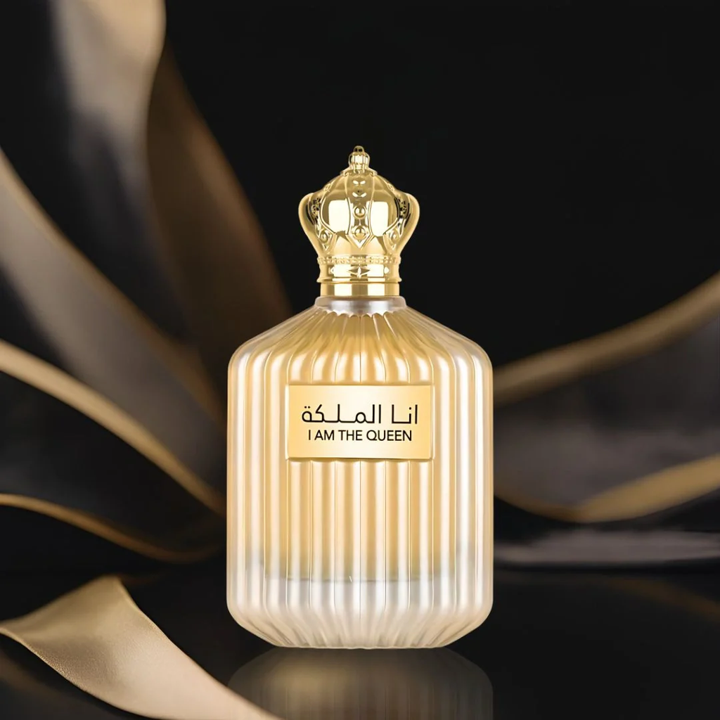 Perfume bottle with gold accents and decorative background. I Am The Queen Womens Perfume by Ard Al Zaafaran