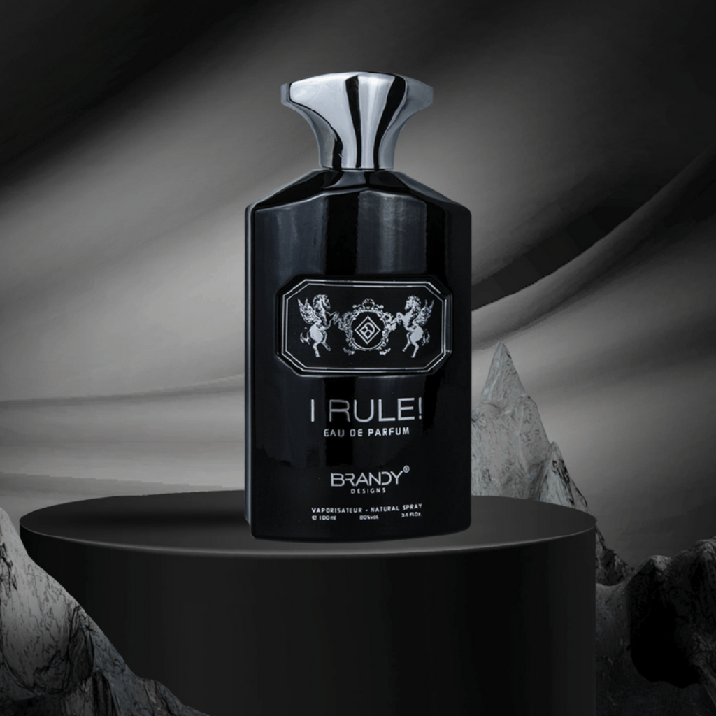 Black perfume bottle labeled 'I Rule!' on a dark background. I Rule by Brandy Designs Mens Perfume