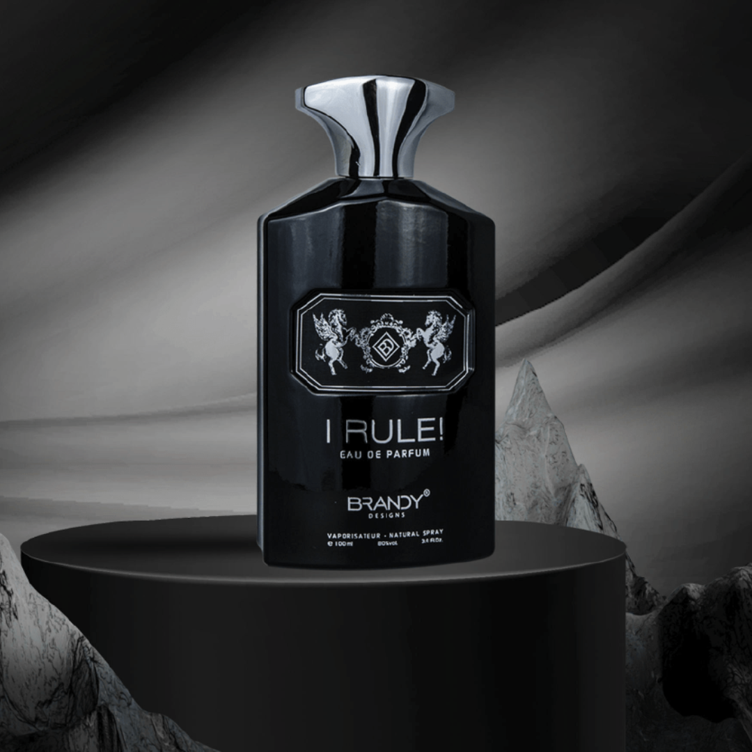 Black perfume bottle labeled 'I Rule!' on a dark background. I Rule by Brandy Designs Mens Perfume