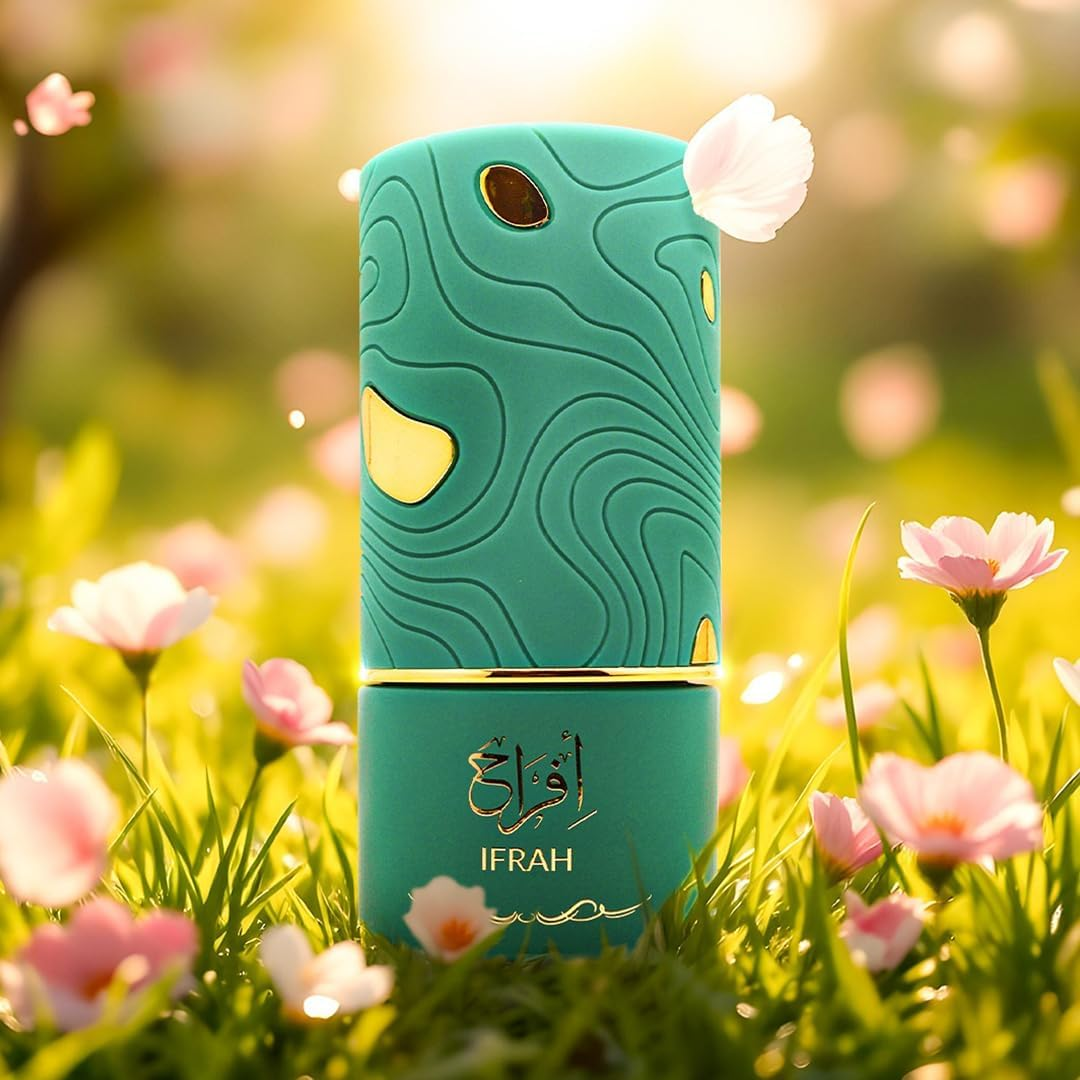 Teal perfume bottle with gold accents on a grassy background with flowers