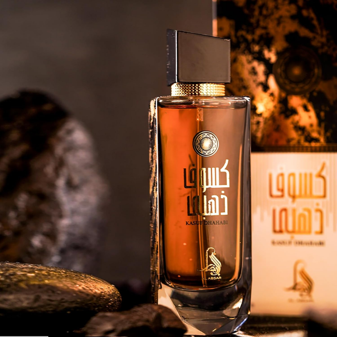 Perfume bottle with a decorative label on a dark background. Kasuf Dahabi by Al Absar Womens Perfume
