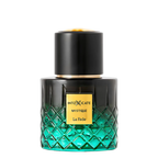 A perfume bottle from the brand INTOXICATE, specifically the 'Mystique La Fede' variant. The bottle is made of a faceted glass that transitions from a dark black top to a vibrant emerald green at the bottom, featuring a textured diamond pattern.