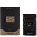 Shiyaaka Shadow perfume by Khadlaj, shown with its black packaging box and the textured black cylindrical bottle on a plain white background.