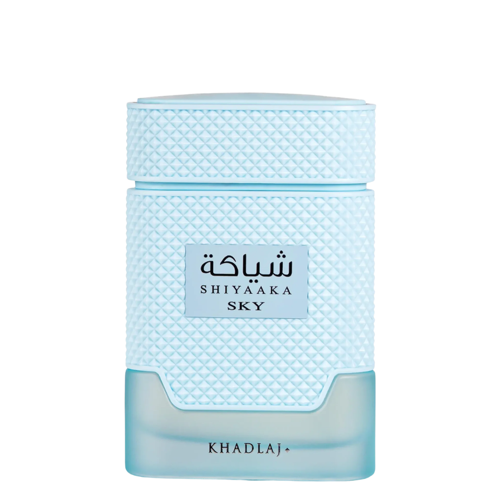 Shiyaaka Sky by Khadlaj perfume bottle in a light blue textured glass design with a clear lower section, shown on a solid white background.