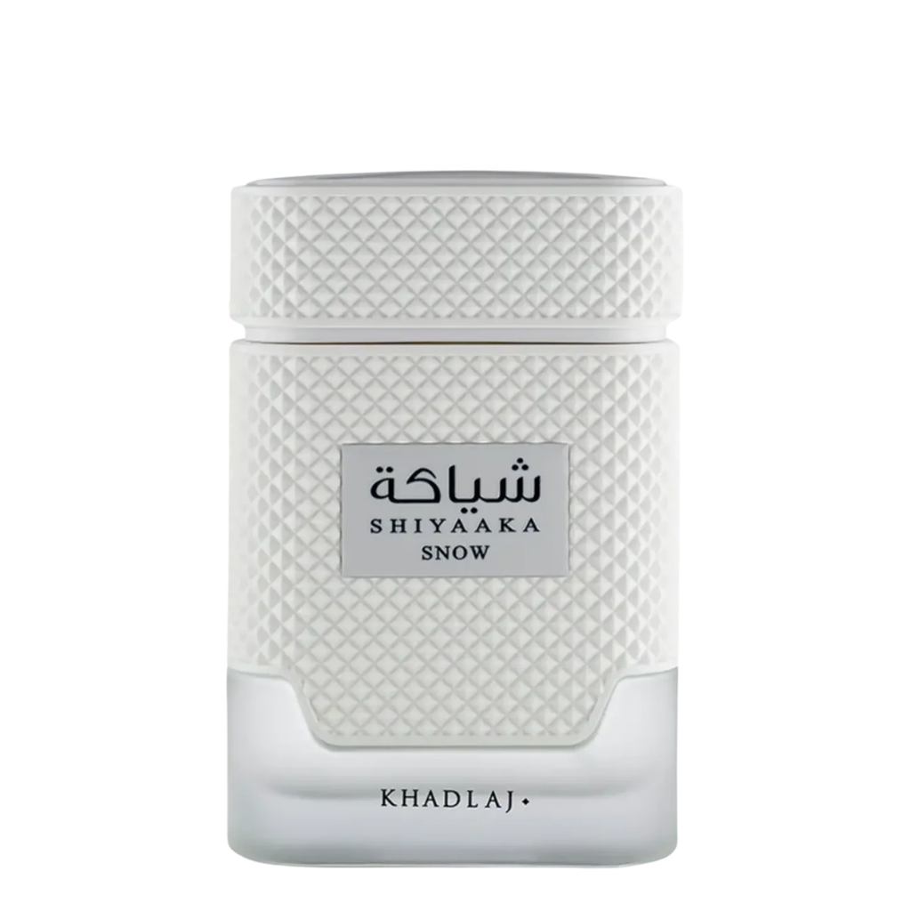 Shiyaaka Snow perfume bottle by Khadlaj, featuring a textured white cap and body with a clear glass base, on a white background.