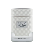 Shiyaaka Snow perfume bottle by Khadlaj, featuring a textured white cap and body with a clear glass base, on a white background.