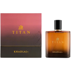 Khadlaj Titan cologne bottle and its packaging box. The bottle is made of amber glass with a textured pattern, a black cap, and gold lettering.
