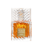 A luxurious crystal bottle of Khamrah unisex fragrance by Lattafa, displaying the amber-colored perfume liquid.  Close-Up of Lattafa Khamrah Perfume Bottle – Detailed view of the premium crystal-cut glass bottle with rich amber liquid and gold label, representing luxury oriental gourmand scents.