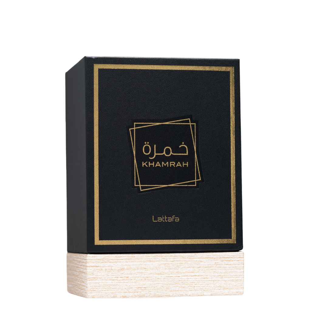 Lattafa Khamrah Premium Perfume Packaging – Stylish black and gold perfume box with textured wooden base, highlighting a high-end Middle Eastern fragrance presentation.