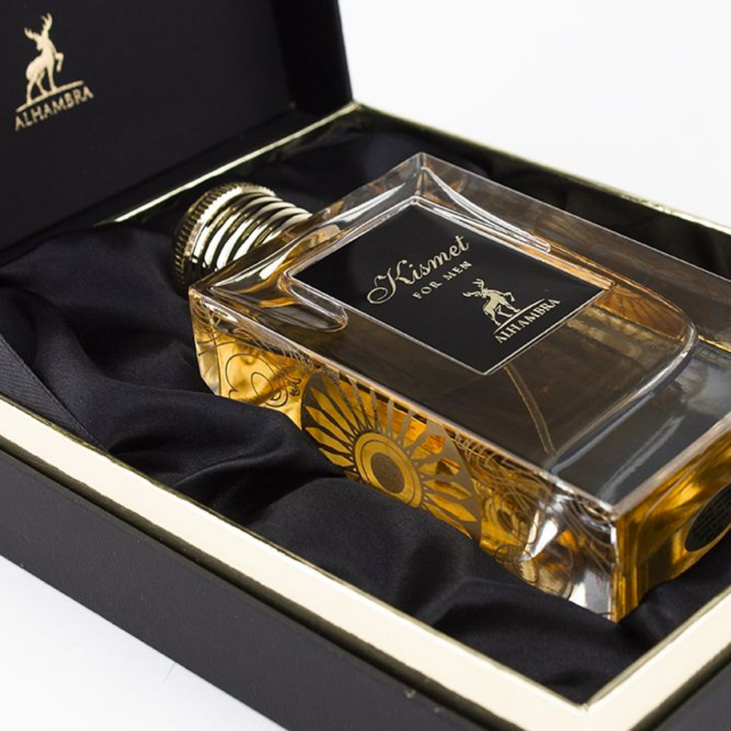 Perfume bottle labeled 'Kismet' by Alhambra in a black box with gold accents.