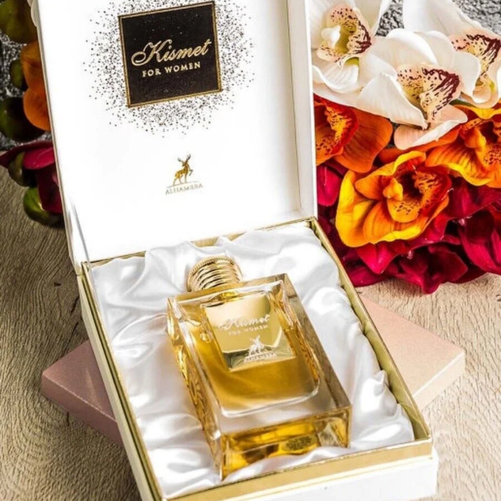 Kismet for women perfume bottle in a decorative box with flowers in the background