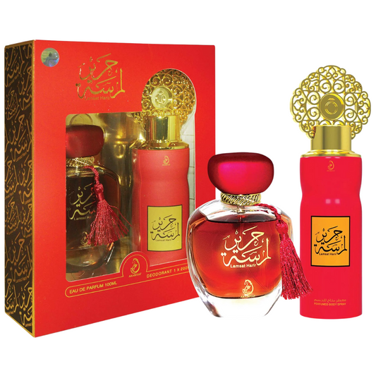 Red perfume bottles with gold caps and decorative packaging on a white background. Lamsat Harir Giftset by Arabiyat Womens Perfume