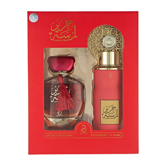 Perfume set with red and gold packaging on a white background. Lamsat Harir Giftset by Arabiyat Womens Perfume