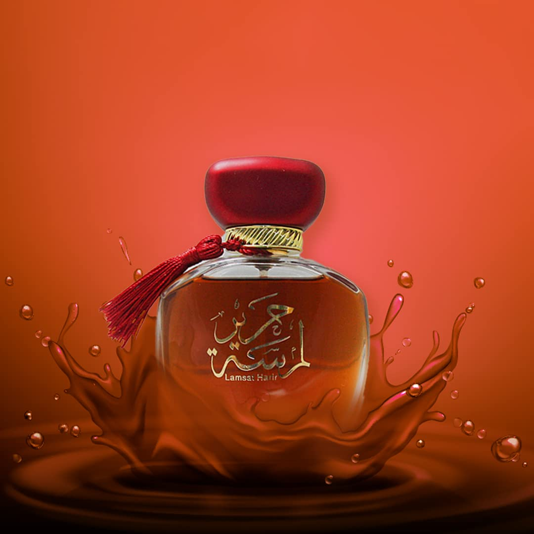 Perfume bottle with Arabic text on a red background. Lamsat Harir by Arabiyat Womens Perfume