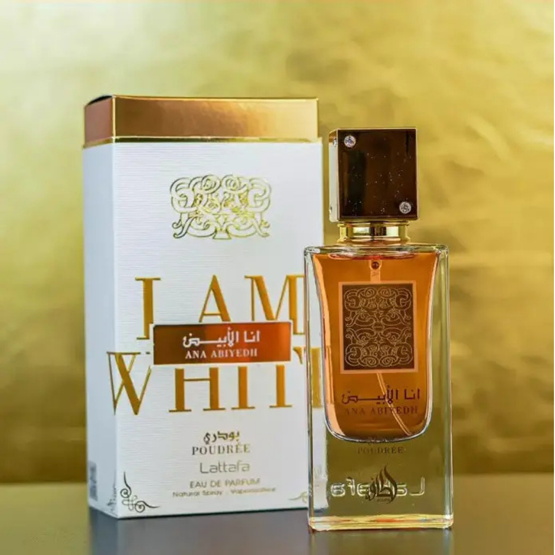 Lattafa Ana Abiyedh Poudrée perfume – premium Arabian fragrance with rich amber juice in a clear bottle, displayed against a golden luxury backdrop. 