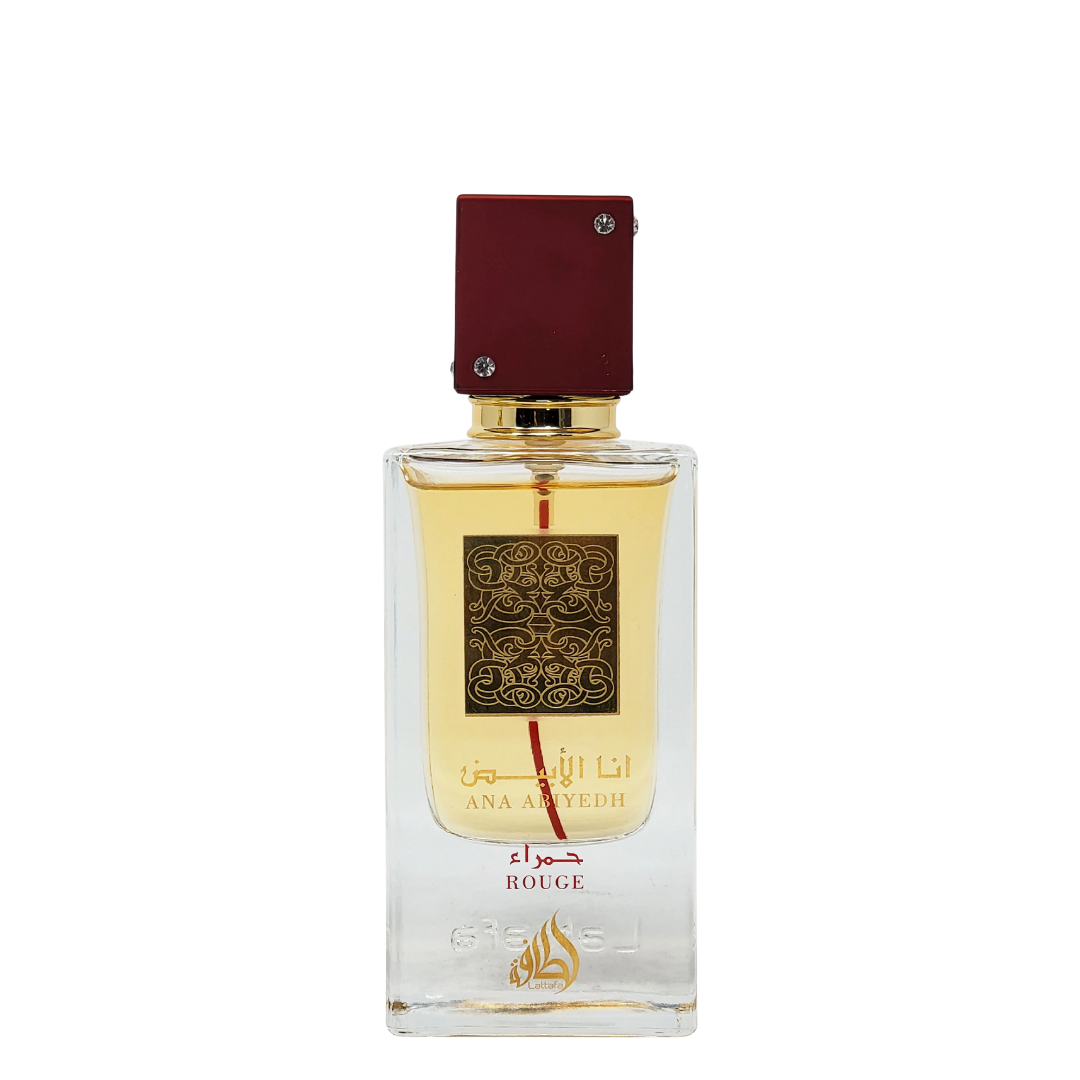 Ana Abiyedh Rouge perfume by Lattafa – elegant Arabian fragrance in a clear glass bottle with gold label, deep red cap, and amber-colored perfume. A bottle of Ana Abiyedh Rouge perfume by Lattafa with a clear glass body and a red cap, displaying the label and the fragrance name. 